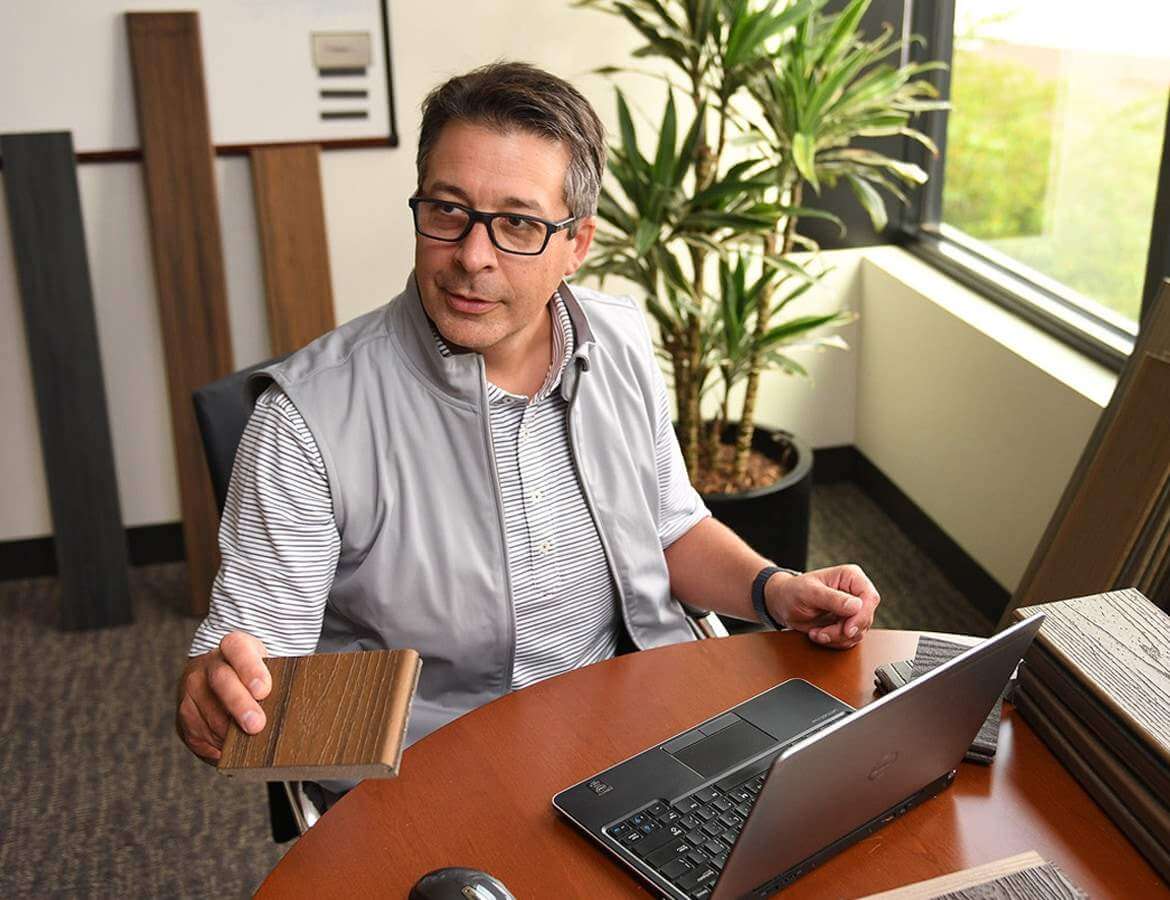 man working on laptop in office