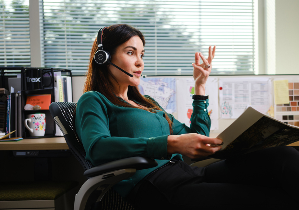 a person wearing a headset and holding a book